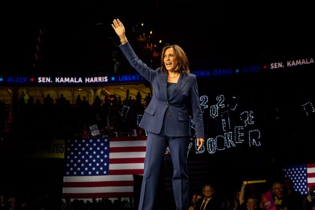 Photo of US Senator Kamala Harris walking on stage at the 2019 Liberty & Justice Celebration in Des Moines, IA.