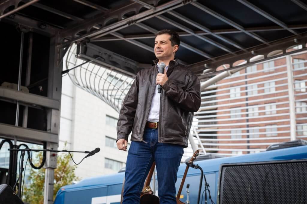 South Bend Mayor Pete Buttigieg takes the stage at a rally in downtown Des Moines